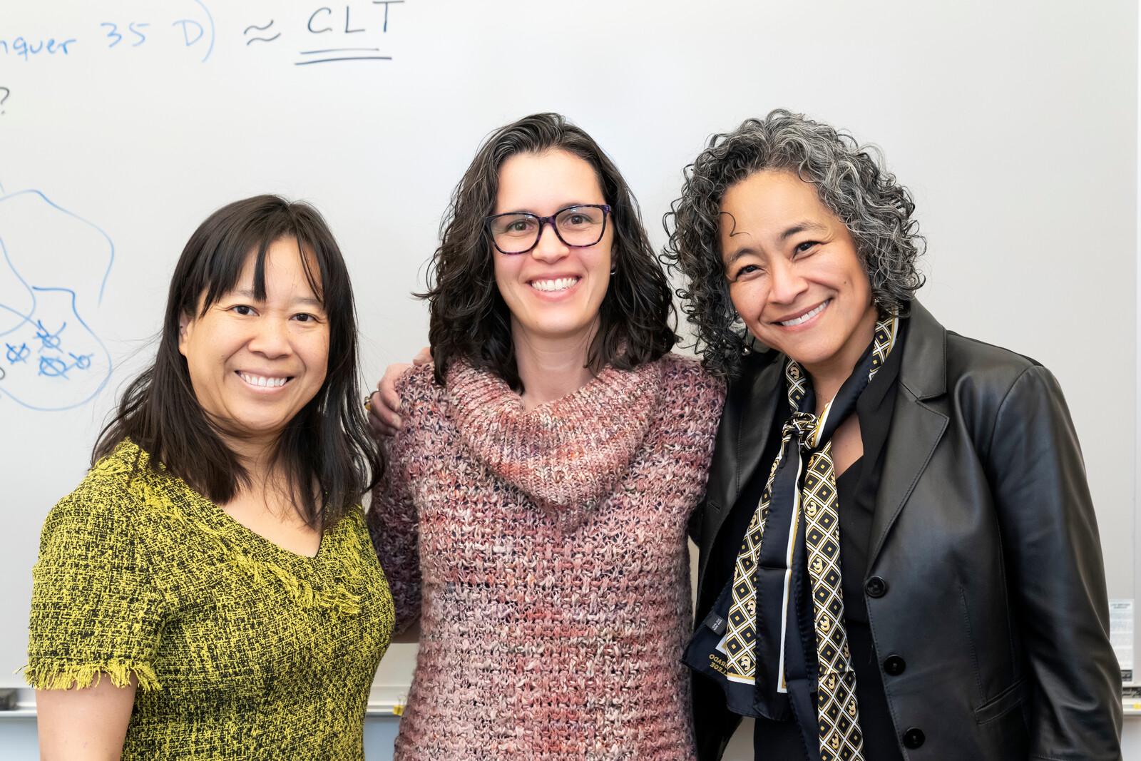 Flavia Sancier-Barbosa, Assistant Professor of Mathematics and Computer Science, center. Dean of Faculty Emily Chan (L) and President L. Song Richardson (R). 